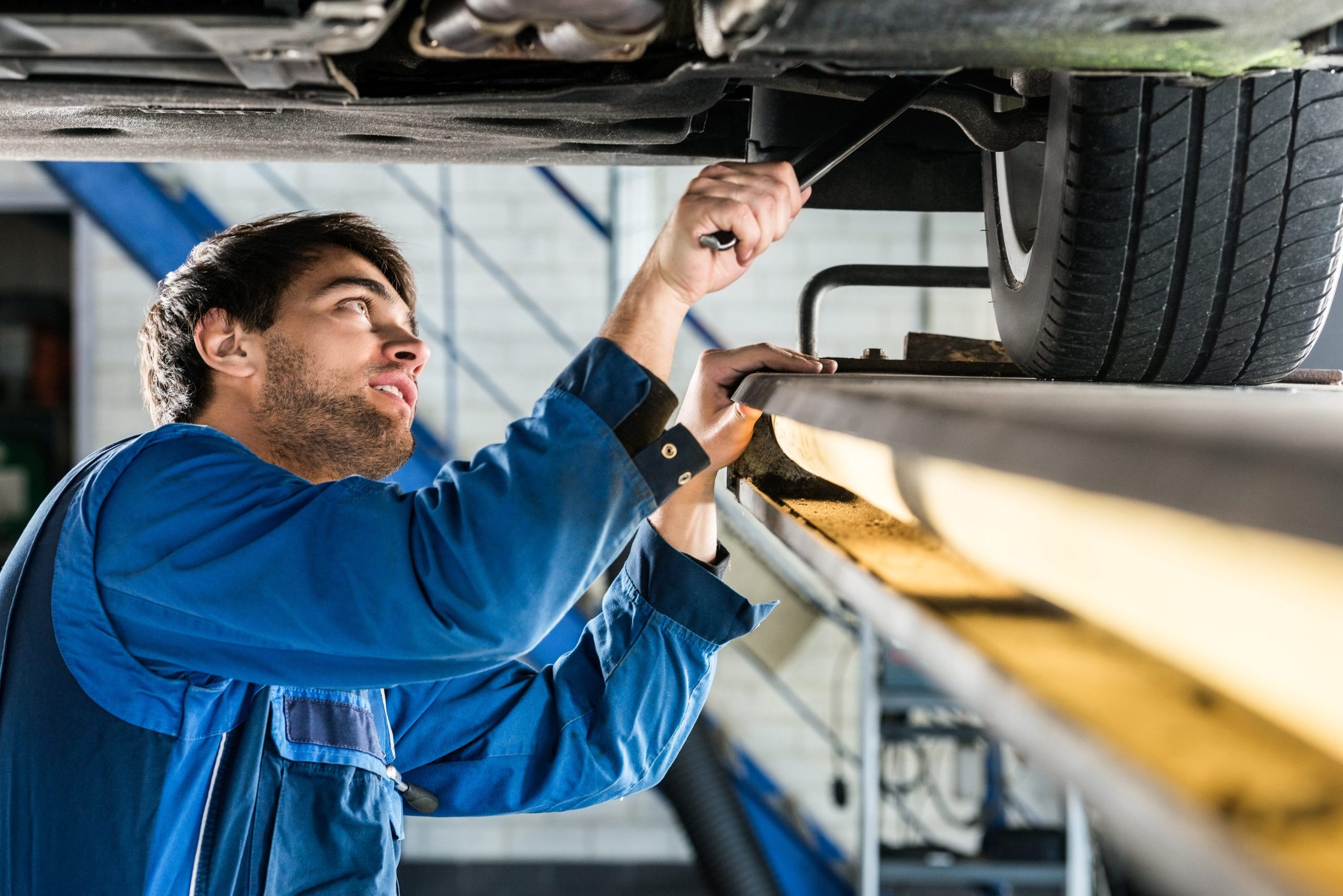 bigstock-Young-male-mechanic-changing-t-148540529-1